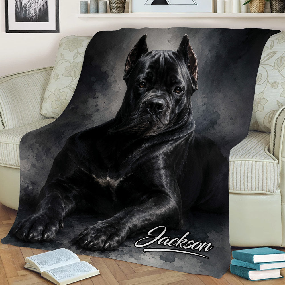 Close view of a black Cane Corso blanket draped over a sofa