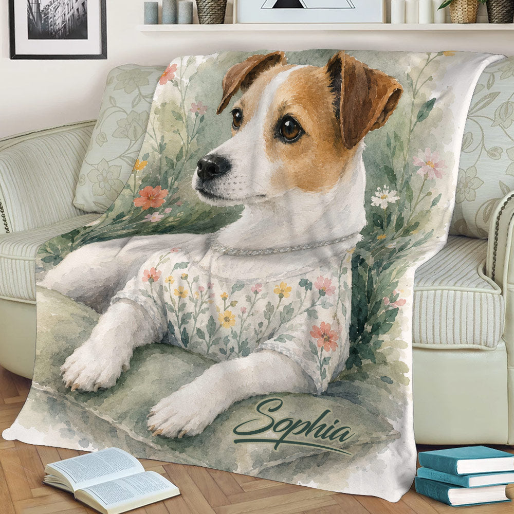 Close view of a watercolor Jack Russell blanket draped over a sofa with floral details