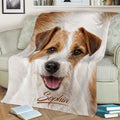 Close view of a Jack Russell dog blanket styled across a sofa with realistic pet artwork