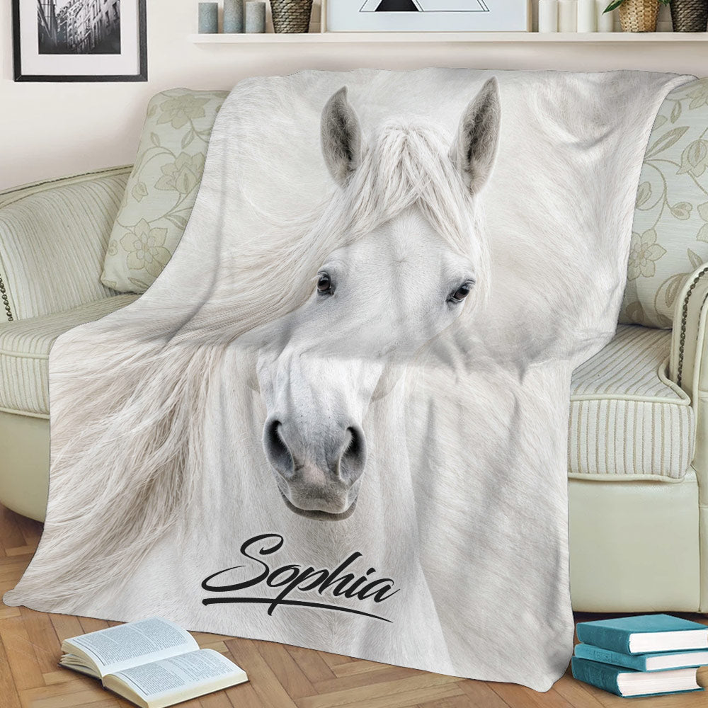 Close view of a white horse throw blanket with flowing mane and elegant monochrome artwork