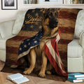 German Shepherd throw blanket featuring American flag colors styled across a living room sofa