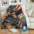Patriotic German Shepherd blanket draped over a sofa with stars, stripes and mountain artwork