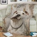 Rustic pitbull throw blanket draped over a sofa with floral details and butterfly accents