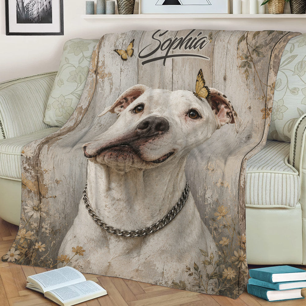 Rustic pitbull throw blanket draped over a sofa with floral details and butterfly accents