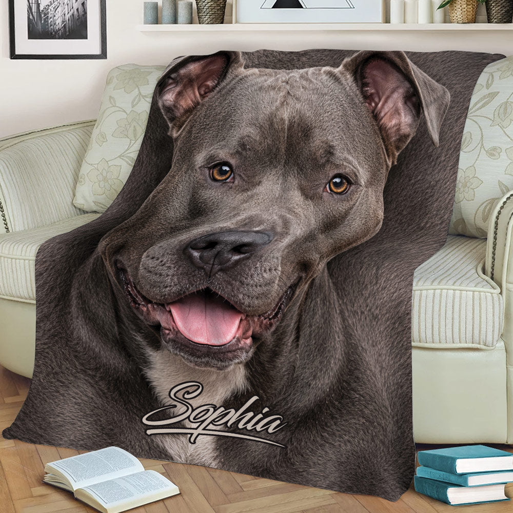Close-up pitbull throw blanket displayed on a sofa with detailed gray dog artwork
