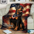 Patriotic Rottweiler throw blanket displayed on a sofa with American flag artwork
