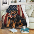 Patriotic Rottweiler blanket displayed on a sofa with American flag artwork and cozy living room decor