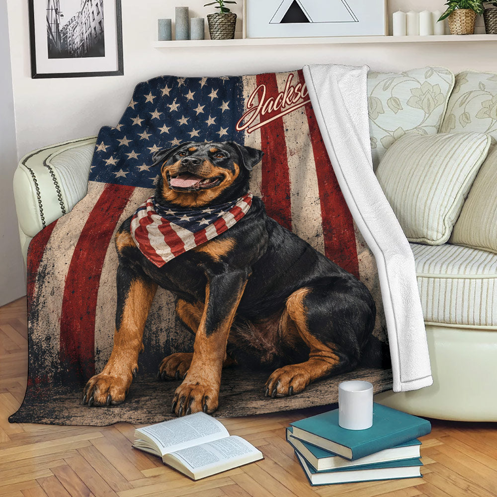 Patriotic Rottweiler blanket displayed on a sofa with American flag artwork and cozy living room decor