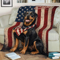 Rottweiler throw blanket draped over a sofa, featuring a seated dog and distressed American flag design