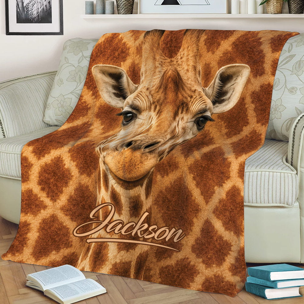 Giraffe throw blanket styled on a couch with a close-up giraffe design and brown spotted pattern