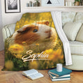 Guinea pig throw blanket displayed on a sofa with warm meadow artwork and cozy reading decor