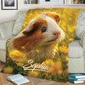 Guinea pig blanket draped across a sofa, featuring a close-up cavy surrounded by yellow flowers