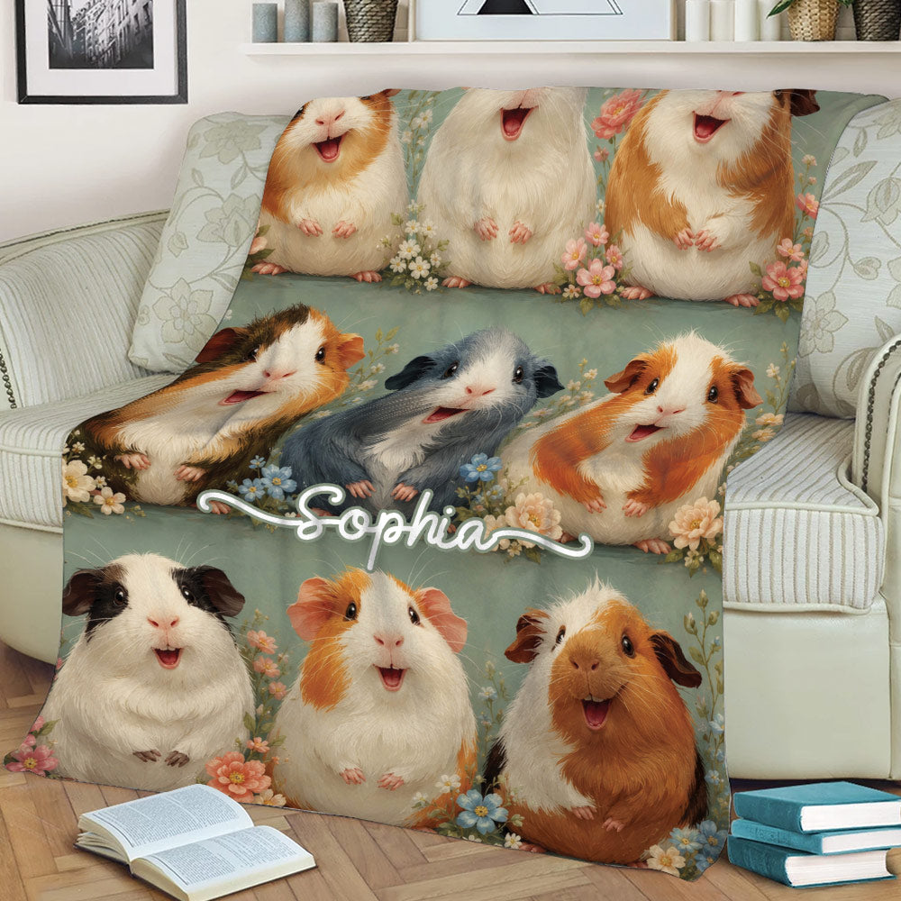 Close view of a guinea pig throw blanket featuring playful cavies and flowers
