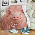 Realistic pink pig throw blanket draped across a living room sofa