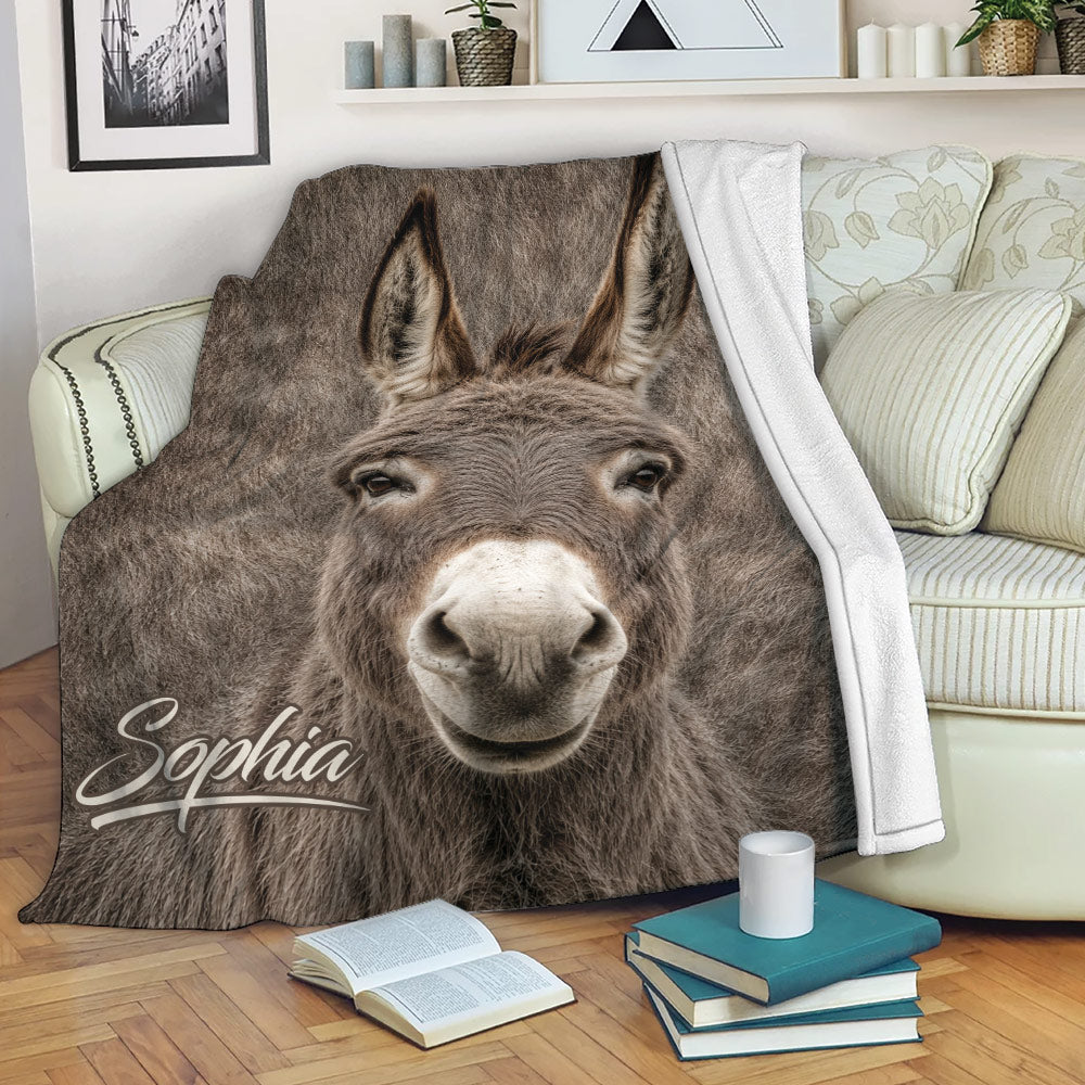 Realistic donkey throw blanket draped over a sofa in a cozy living room reading setting