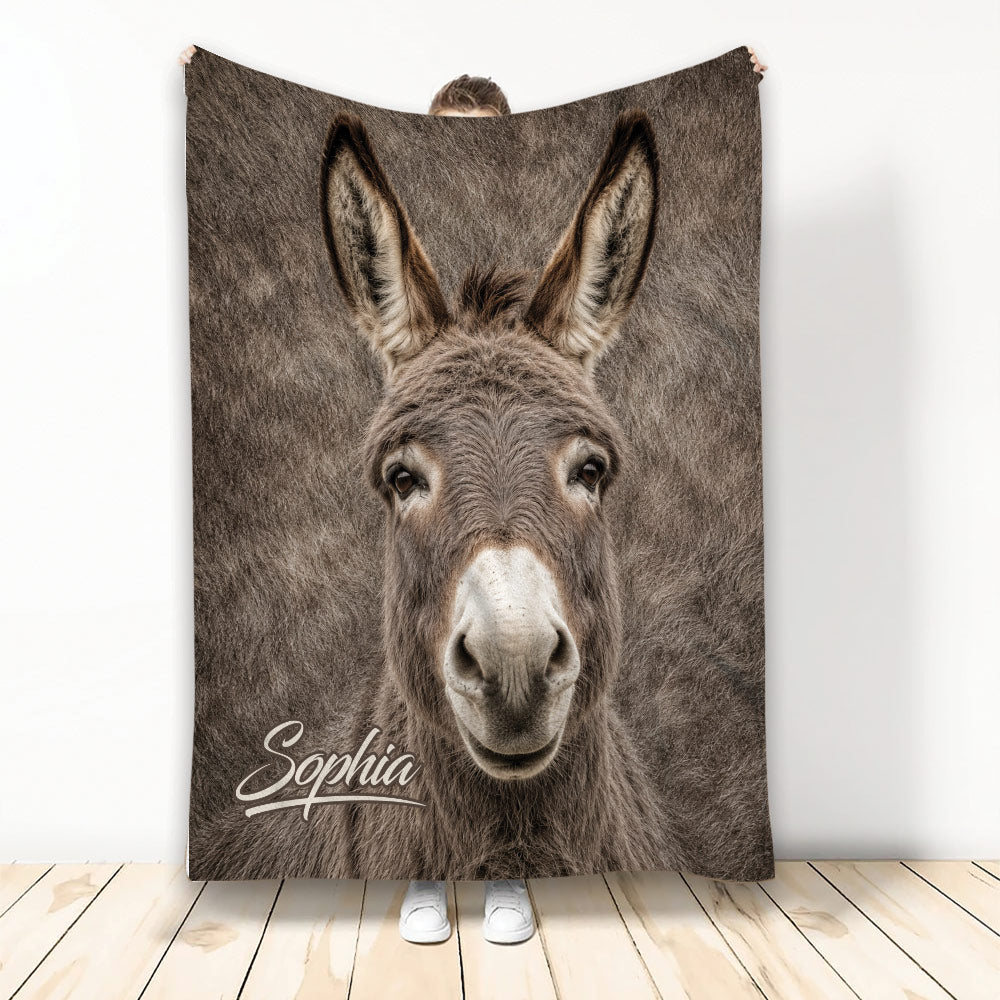 Realistic donkey face blanket displayed vertically in a bright room with a cozy animal design