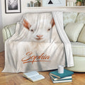 White goat throw blanket draped over a sofa in a cozy living room setting