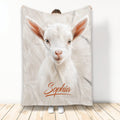 White goat face throw blanket displayed against a light background with warm rustic styling