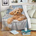 Labradoodle throw blanket displayed on a sofa with a playful bath scene and cozy reading nook