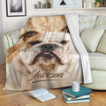 English Bulldog blanket draped over a sofa with a close-up bulldog design in a cozy living room