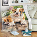 English Bulldog throw blanket draped over a sofa with vibrant garden artwork