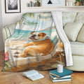 English Bulldog throw blanket displayed on a sofa with colorful beach artwork and tropical coastal decor