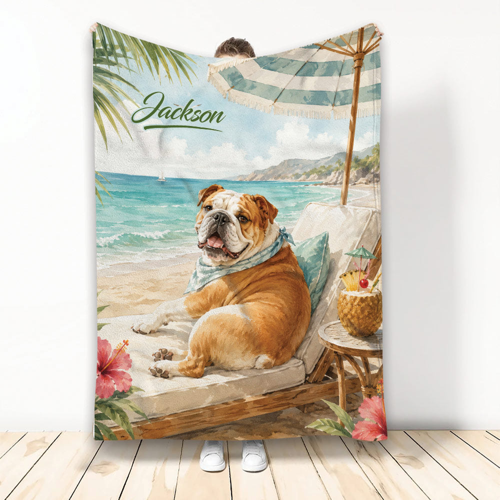 English Bulldog blanket featuring a tropical beach scene, striped umbrella, palm leaves, and seaside lounging artwork