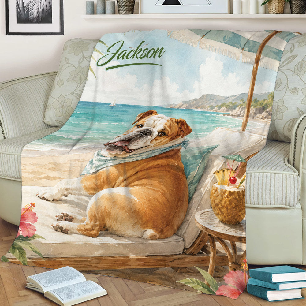 English Bulldog beach throw blanket styled on a sofa with ocean waves, palm leaves, and tropical drink artwork