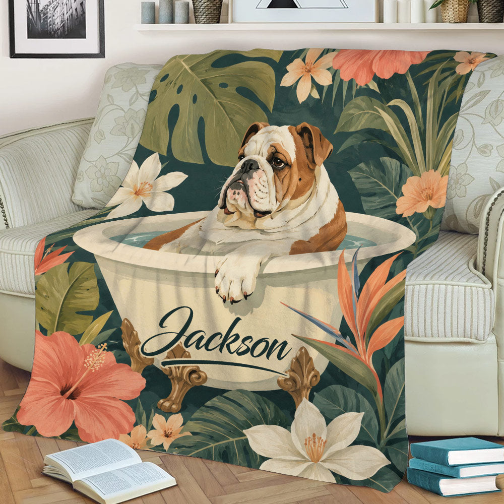 English Bulldog blanket draped over an armchair, featuring tropical foliage, large flowers, and a decorative bathtub scene