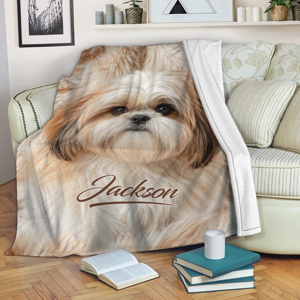 Shih Tzu blanket draped across a living room sofa with cozy dog artwork