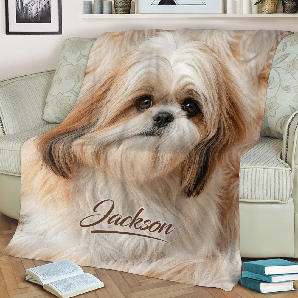 Close view of a Shih Tzu throw blanket styled on a sofa with warm neutral artwork