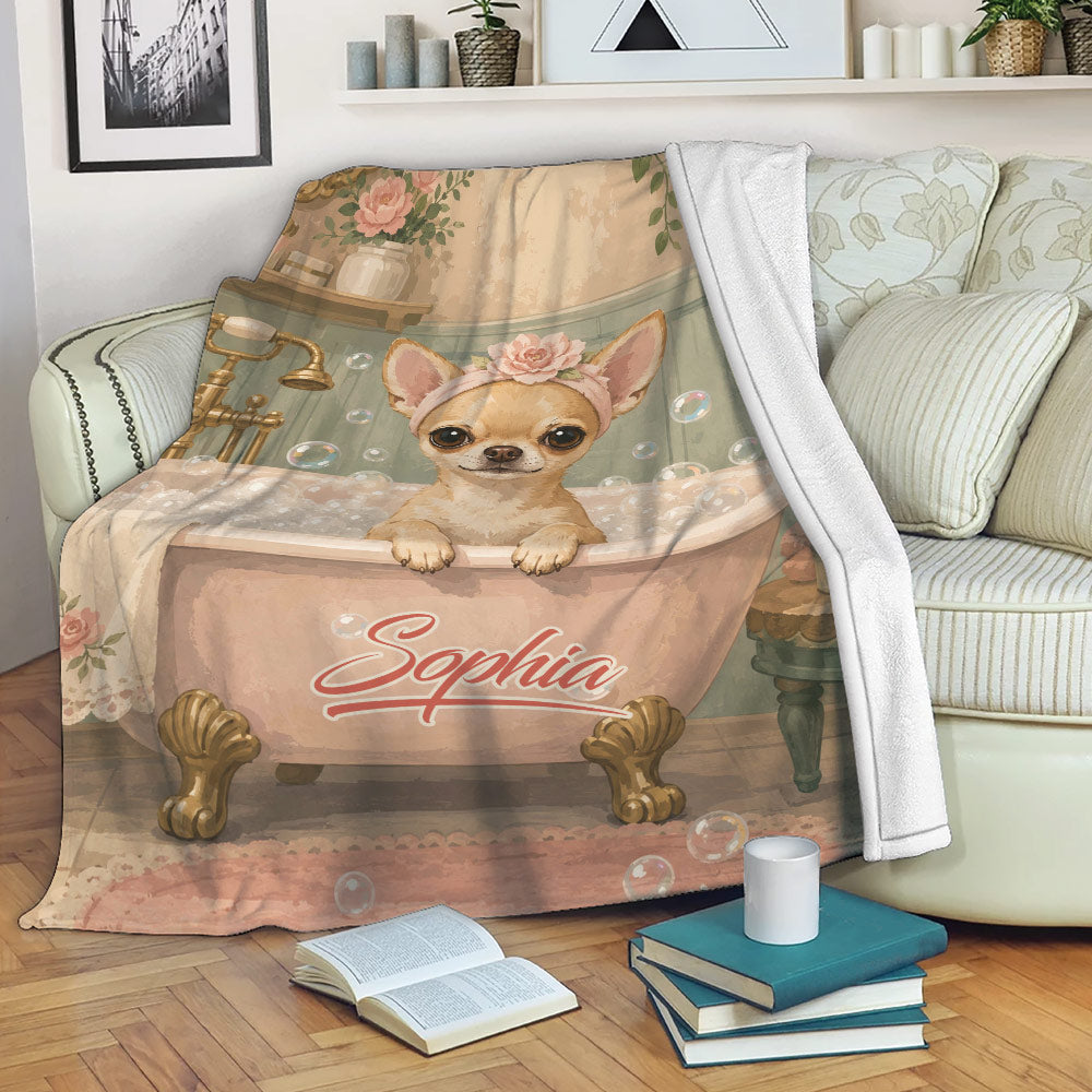 Chihuahua blanket draped over a sofa with vintage bathroom artwork and floral details