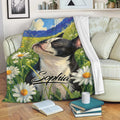 Boston Terrier throw blanket draped over a sofa with colorful wildflower meadow artwork
