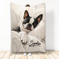 Boston Terrier throw blanket featuring a sleeping black-and-white dog in soft neutral bedding