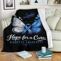 Diabetes awareness throw blanket displayed on a sofa with blue butterfly ribbon artwork
