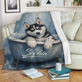 Husky puppy bathtub blanket displayed as a cozy couch throw in a living room
