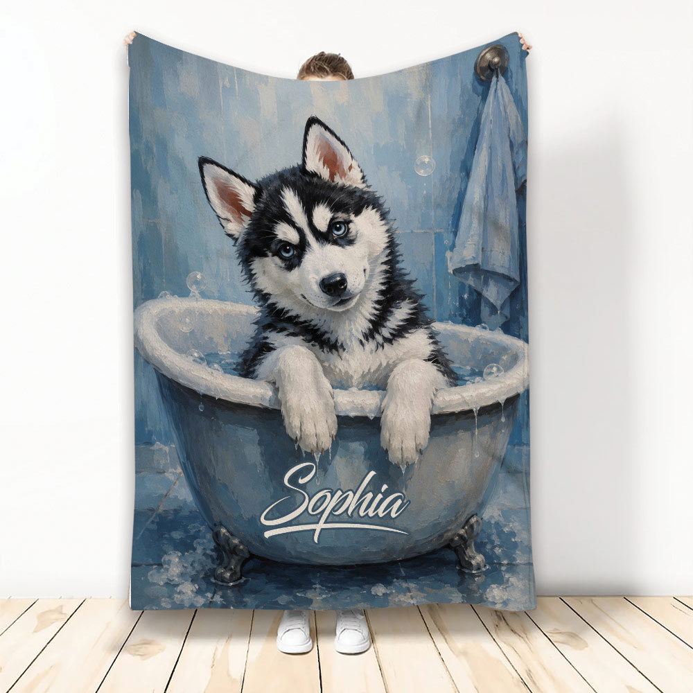 Husky puppy artwork in a blue vintage bathtub on a printed throw blanket