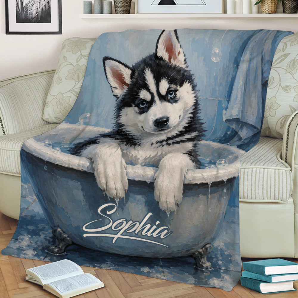 Close view of a blue Husky puppy throw blanket styled across a sofa