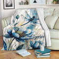 Dragonfly and blue floral watercolor throw blanket styled on a living room sofa