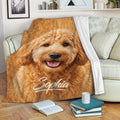 Goldendoodle blanket draped over a sofa, showcasing a cheerful curly dog design in a cozy room