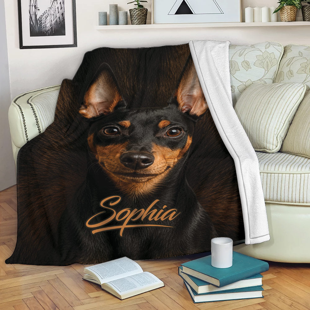 Miniature Pinscher throw blanket styled on a sofa with black-and-tan dog artwork