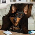 Miniature Pinscher throw blanket draped across a sofa in a cozy living room