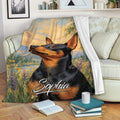 Miniature Pinscher throw blanket displayed on a sofa with scenic landscape artwork