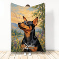 Miniature Pinscher blanket featuring black and tan dog artwork in a colorful mountain meadow scene