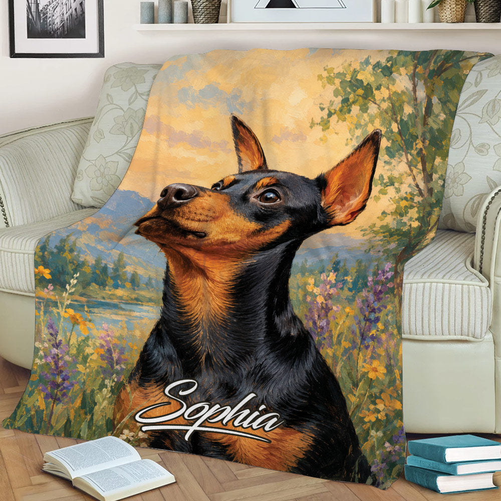 Close view of a Miniature Pinscher throw blanket with painterly flowers, trees, and mountain scenery