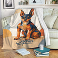 Miniature Pinscher throw blanket featuring bold geometric artwork styled on a cozy living room sofa