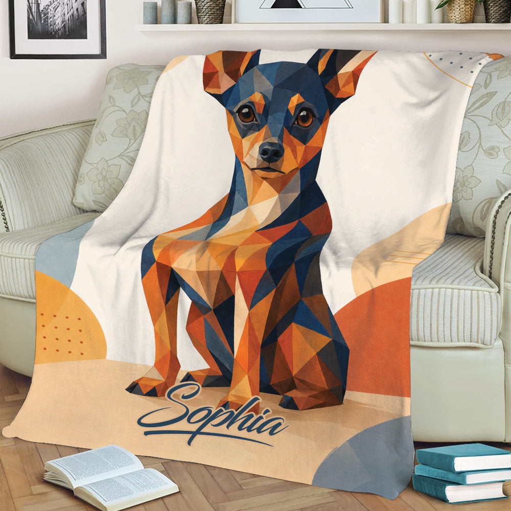 Geometric Miniature Pinscher blanket draped over a sofa with colorful angular dog artwork