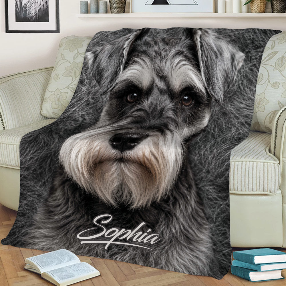 Grayscale Miniature Schnauzer throw blanket styled on a sofa with books nearby