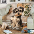 Close view of a Miniature Schnauzer throw blanket with rustic botanical artwork on a couch