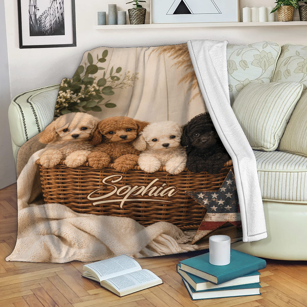 Poodle blanket draped over a sofa, showing four curly-coated puppies and a cozy neutral home setting
